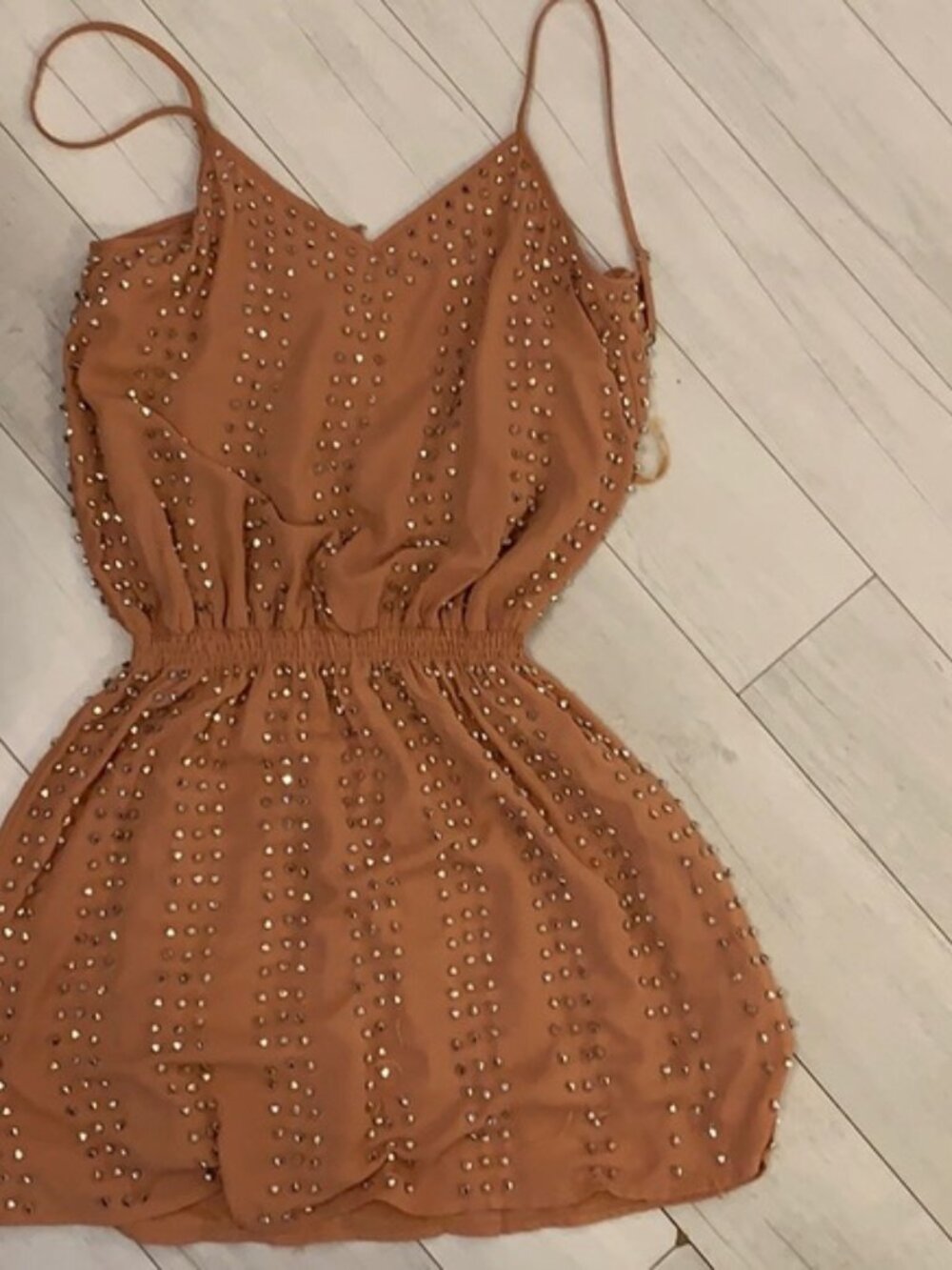 Beige mini dress with silver details all over.